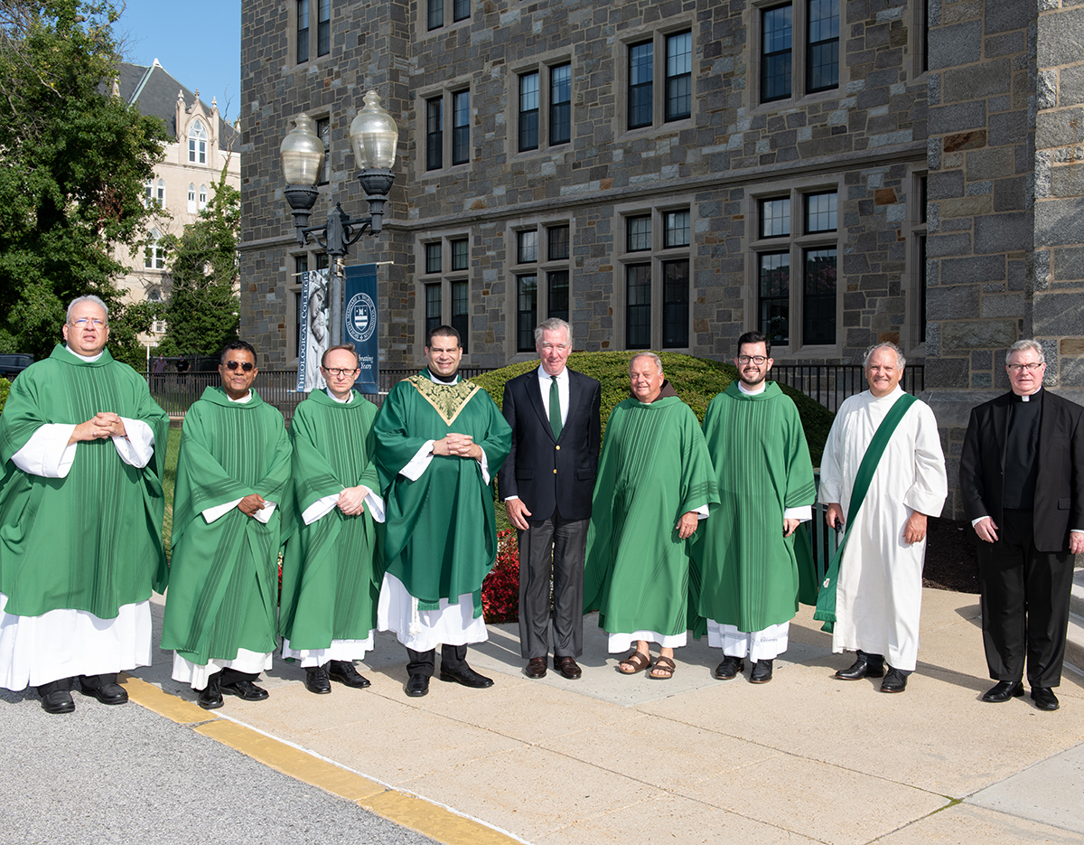 TC faculty with CUA President John Garvey